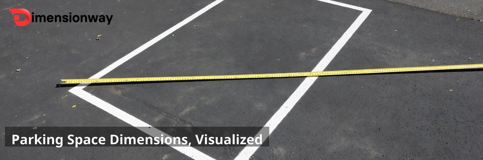 An empty painted parking space in an asphalt lot with a yellow measuring tape stretched across its width.