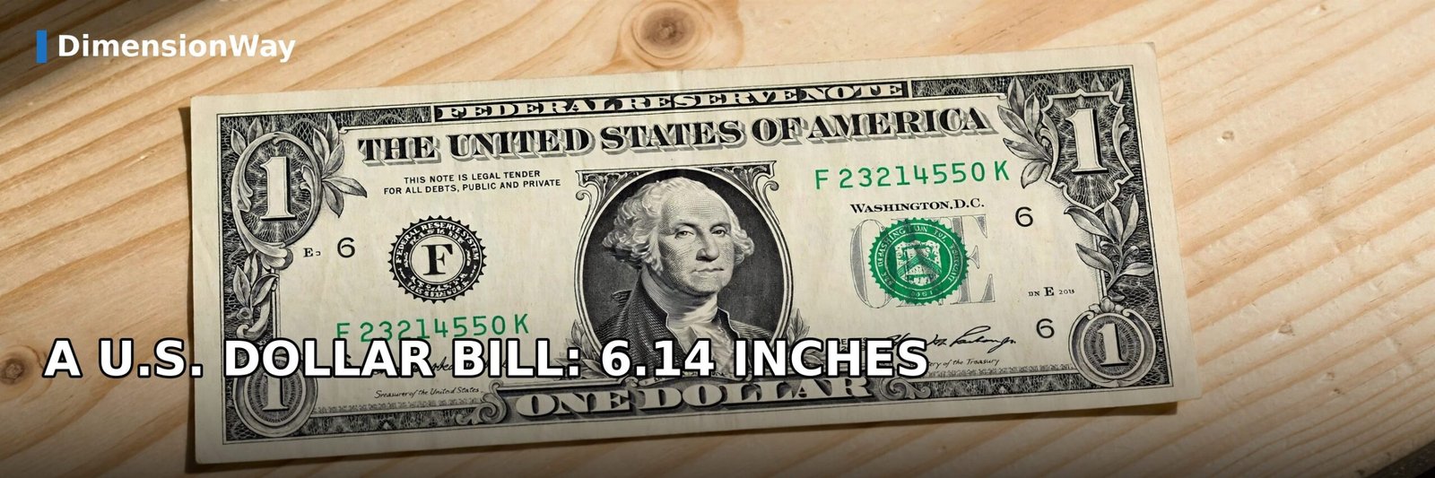 US one-dollar bill lying flat on a wooden table, measuring 6.14 inches long