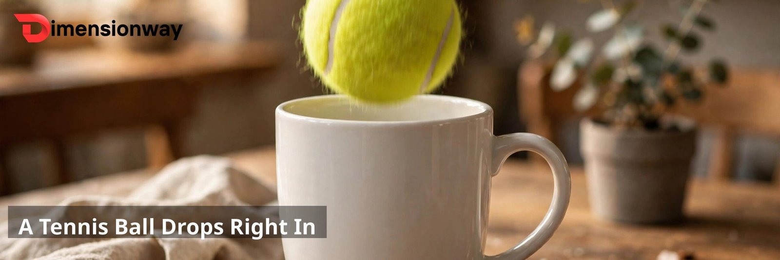 A yellow-green tennis ball dropping into an open white ceramic coffee mug.