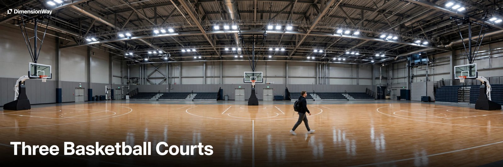 Person walking past three basketball courts lined up end to end.
