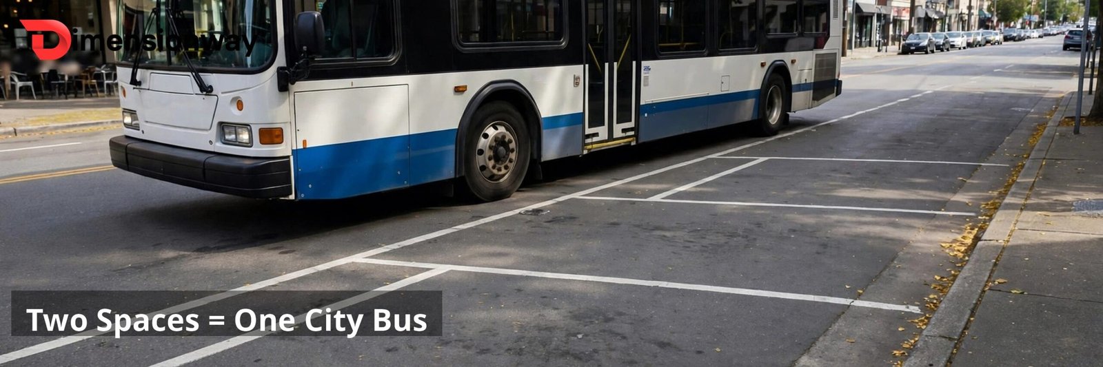 A city transit bus parked beside two empty painted parking spaces end to end.