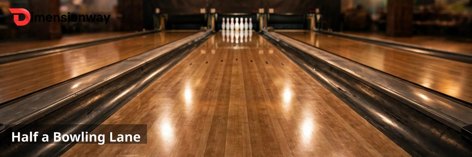 A bowling lane seen from behind the foul line with pins standing at the far end.