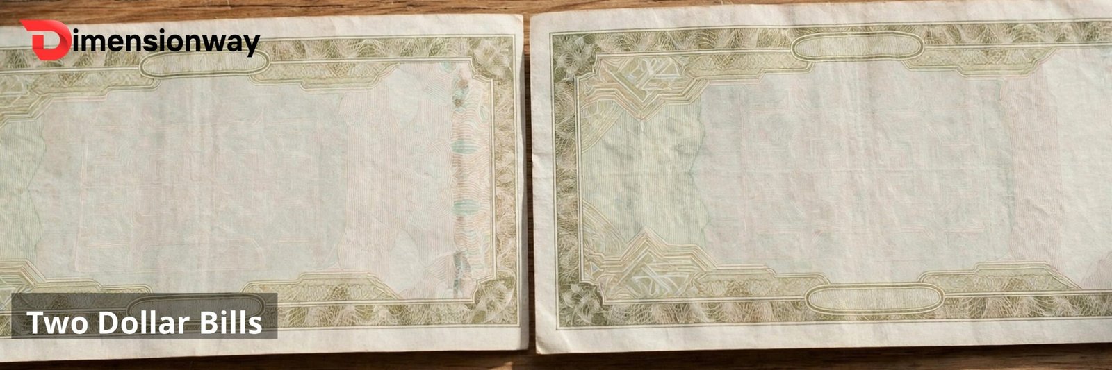 Two dollar bills laid end to end on a table.