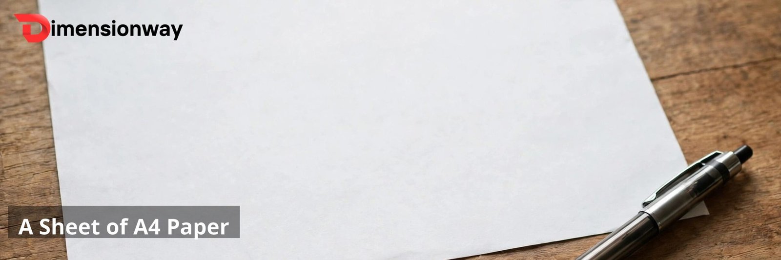A sheet of A4 paper on a desk with a pen beside it.