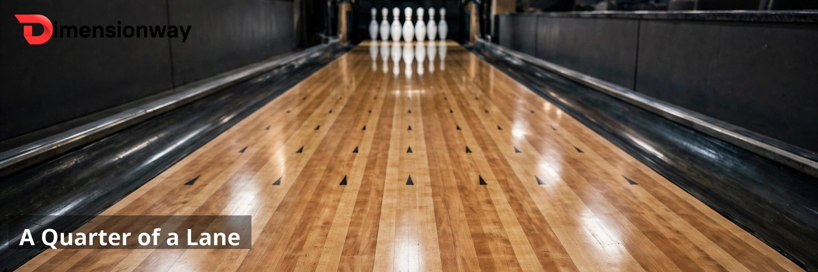 A bowling lane seen from behind the foul line with pins standing at the far end.